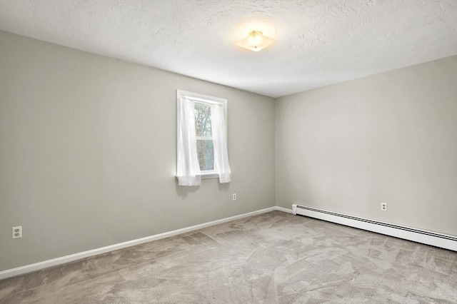 184 Burlingame Rd, Charlton, MA 01507 - carpeted empty room with baseboard heating, baseboards, and a textured ceiling