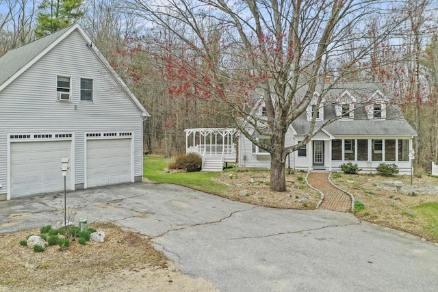 184 Burlingame Rd, Charlton, MA 01507 - view of home's exterior featuring a sunroom and driveway