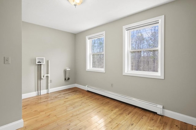 184 Burlingame Rd, Charlton, MA 01507 - unfurnished room with baseboards, light wood-style floors, and a baseboard radiator