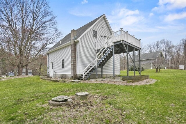 184 Burlingame Rd, Charlton, MA 01507 - view of property exterior with a lawn, roof with shingles, a wooden deck, and stairs