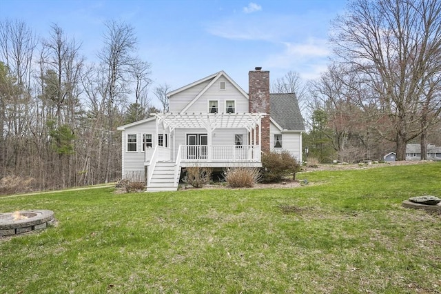 184 Burlingame Rd, Charlton, MA 01507 - rear view of property featuring a deck, a chimney, a yard, a fire pit, and a pergola