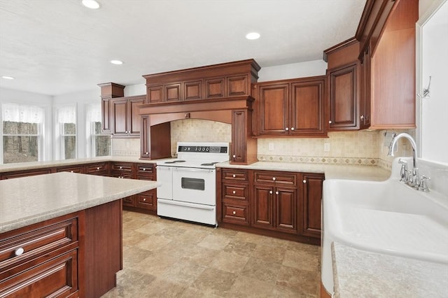 184 Burlingame Rd, Charlton, MA 01507 - kitchen featuring tasteful backsplash, white range with electric cooktop, light countertops, and recessed lighting