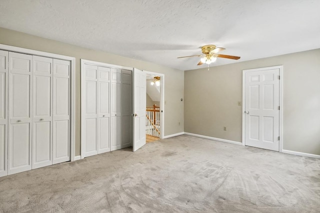 184 Burlingame Rd, Charlton, MA 01507 - unfurnished bedroom with ceiling fan, multiple closets, carpet flooring, and baseboards