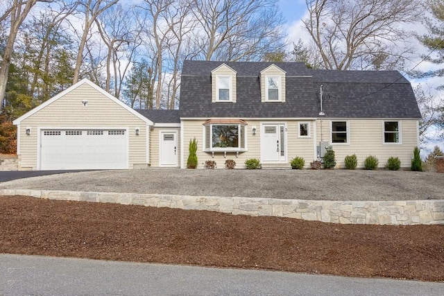 cape cod-style house with a garage