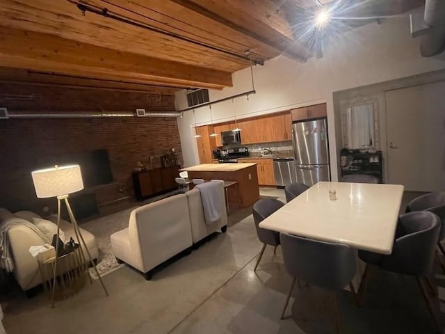 130 John Unit 213, Lowell, MA 01852 - living room with beam ceiling, concrete floors, and a wall mounted AC