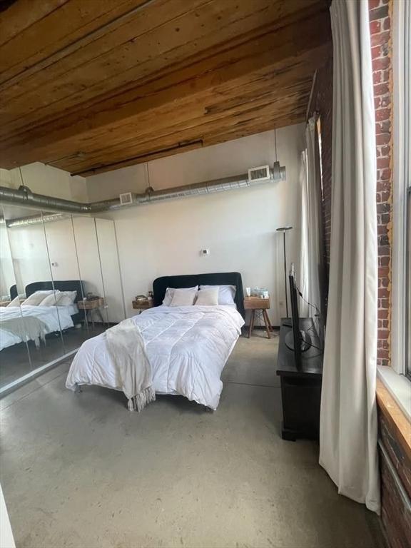 130 John Unit 213, Lowell, MA 01852 - bedroom featuring concrete flooring