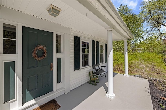 view of exterior entry with covered porch