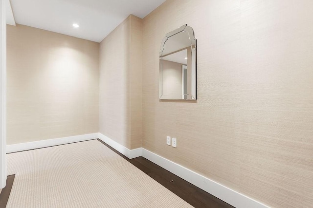 spare room with baseboards