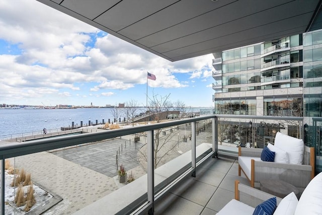 balcony featuring a water view