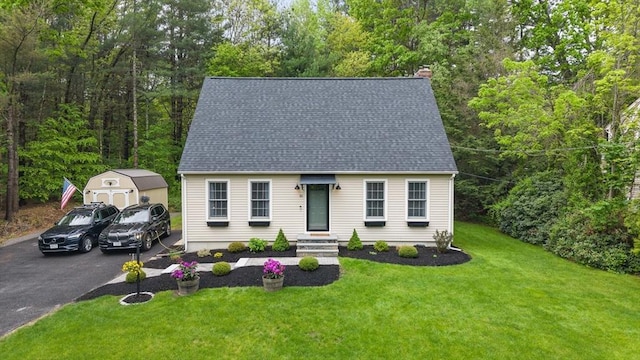 10 Old Broad St, Holden, MA 01522 - cape cod house featuring a front lawn, a chimney, a shingled roof, and driveway