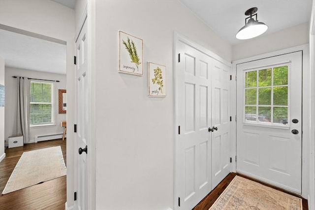 10 Old Broad St, Holden, MA 01522 - entryway featuring baseboard heating, dark wood finished floors, and baseboards