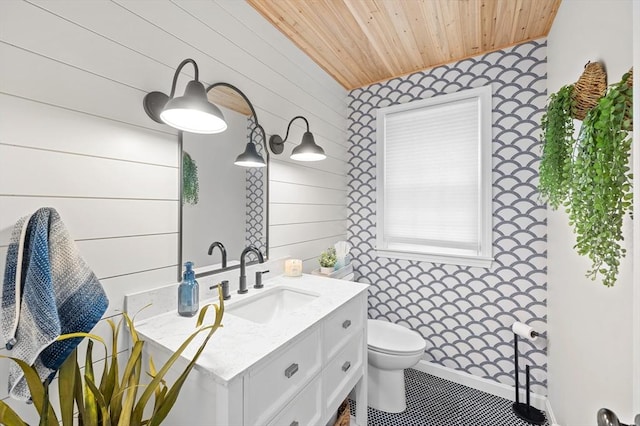 10 Old Broad St, Holden, MA 01522 - bathroom featuring wooden ceiling, vanity, toilet, wooden walls, and tile patterned flooring