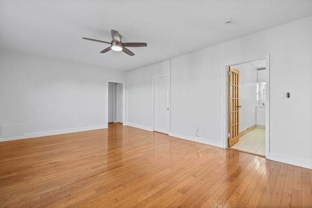 unfurnished bedroom with ceiling fan, light hardwood / wood-style floors, and ensuite bath