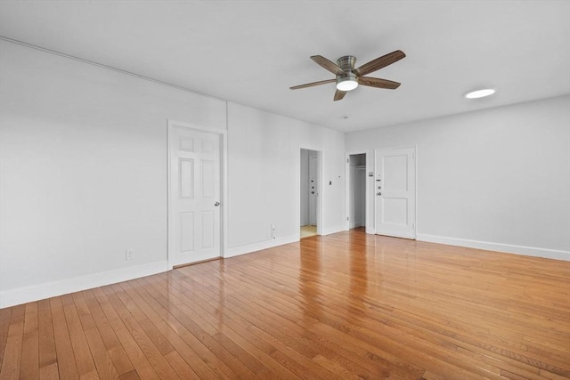 empty room featuring ceiling fan and light wood-type flooring