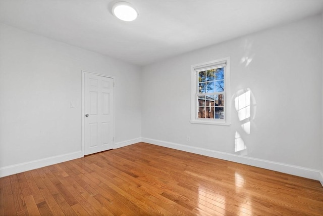 empty room with wood-type flooring