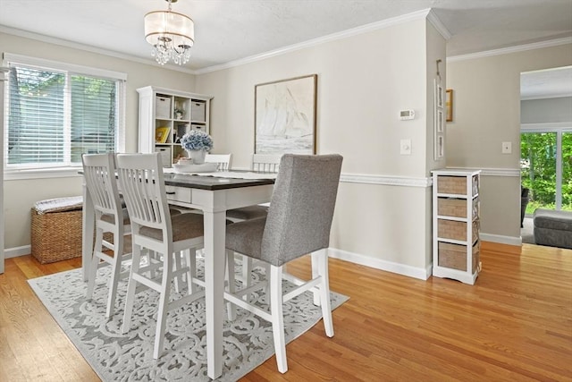 26 Gaslight Ln Unit 26, Easton, MA 02356 - dining area with light wood-type flooring, crown molding, a chandelier, and baseboards