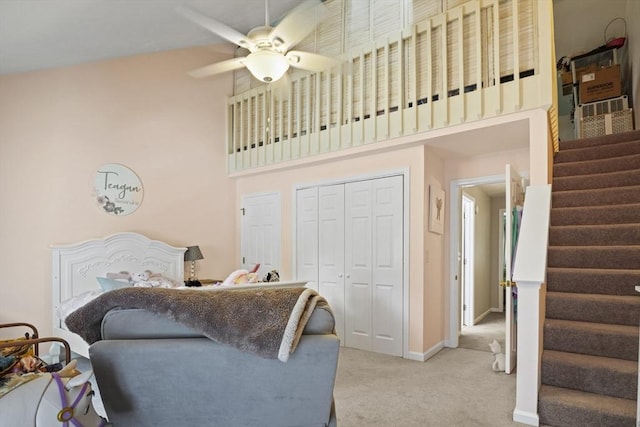 26 Gaslight Ln Unit 26, Easton, MA 02356 - living room featuring carpet flooring, stairway, ceiling fan, a high ceiling, and baseboards