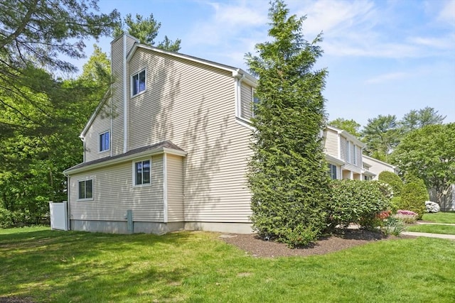 26 Gaslight Ln Unit 26, Easton, MA 02356 - view of side of home with a yard and a chimney