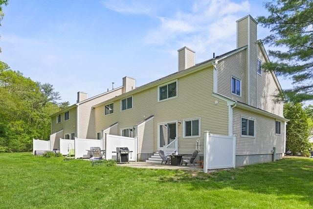 26 Gaslight Ln Unit 26, Easton, MA 02356 - back of property with a chimney, entry steps, and a patio