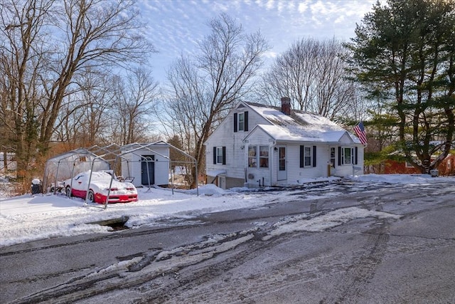 view of front of property with a storage shed