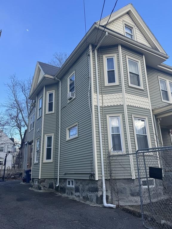 view of home's exterior with cooling unit