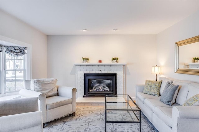 living room with recessed lighting and a fireplace