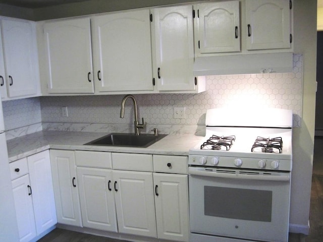 kitchen featuring white cabinetry, white gas range, sink, and backsplash