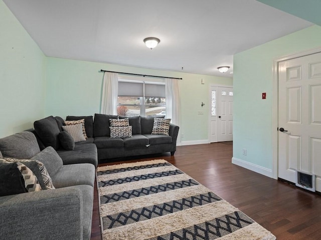 living room featuring dark wood-type flooring