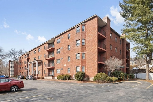 view of property with uncovered parking