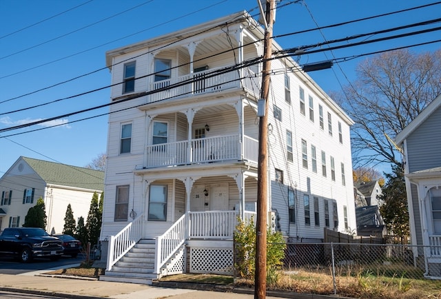 view of front facade with a porch and a balcony