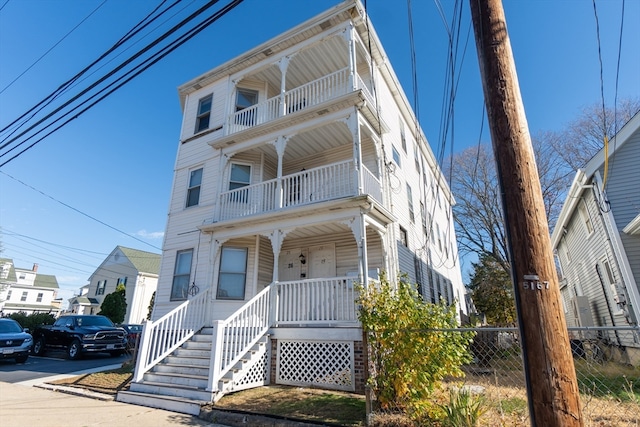 view of front facade with a porch and a balcony