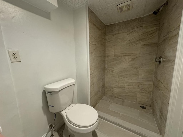 full bathroom featuring visible vents, a stall shower, and toilet