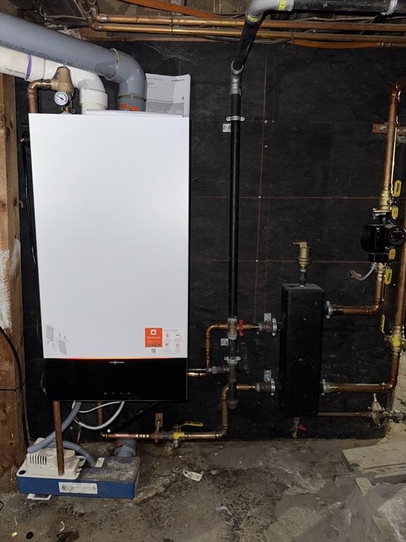 utility room with water heater