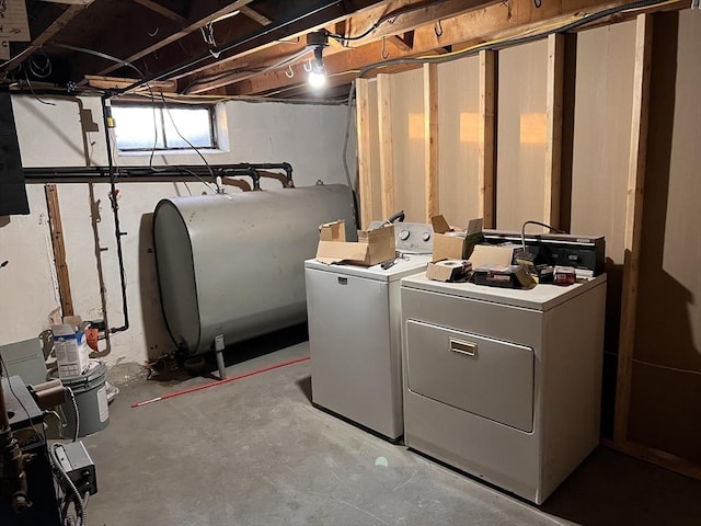 washroom with washing machine and clothes dryer