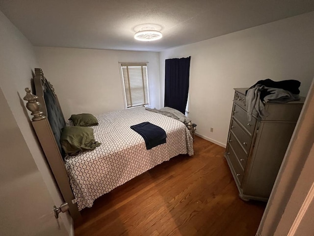 bedroom featuring dark hardwood / wood-style floors