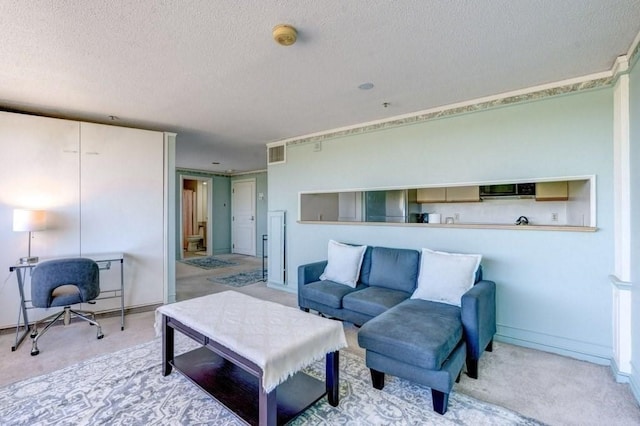 living room featuring a textured ceiling, carpet floors, and baseboards