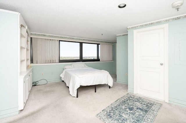 bedroom featuring light colored carpet