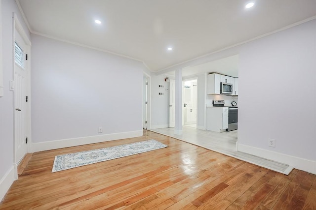 73 Laurie Ave, Abington, MA 02351 - foyer with crown molding, light wood-style flooring, recessed lighting, and baseboards