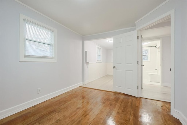 73 Laurie Ave, Abington, MA 02351 - empty room featuring crown molding, baseboards, and light wood-type flooring