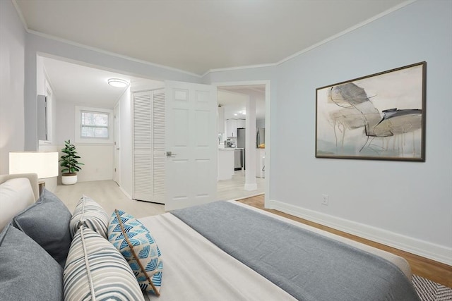73 Laurie Ave, Abington, MA 02351 - bedroom featuring light wood-style floors, baseboards, crown molding, and freestanding refrigerator