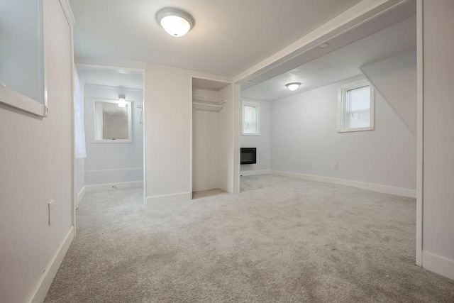 73 Laurie Ave, Abington, MA 02351 - below grade area with baseboards, a glass covered fireplace, carpet, and heating unit