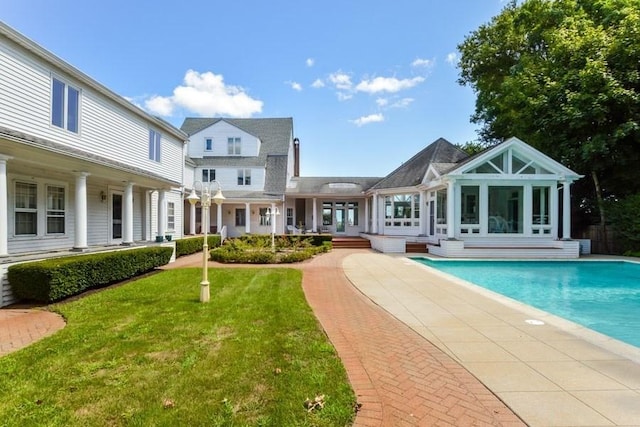 188 S St, Yarmouth, MA 02664 - rear view of property featuring an outdoor pool, french doors, and a yard