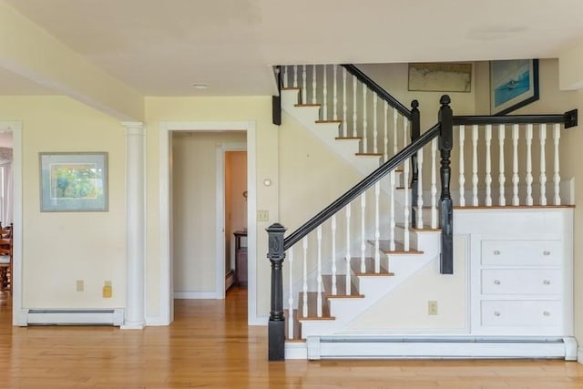 188 S St, Yarmouth, MA 02664 - stairs with a baseboard radiator, wood finished floors, and baseboards