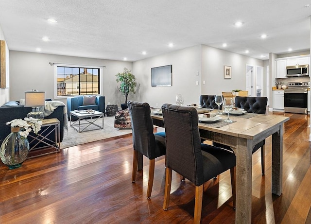 dining area with dark wood-type flooring