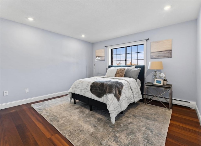 bedroom with dark hardwood / wood-style flooring