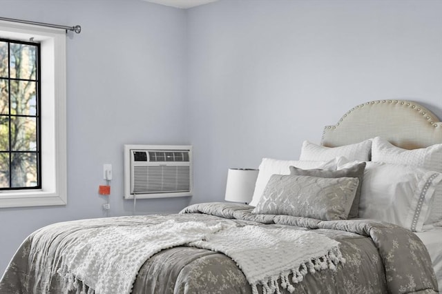 bedroom with a wall mounted air conditioner