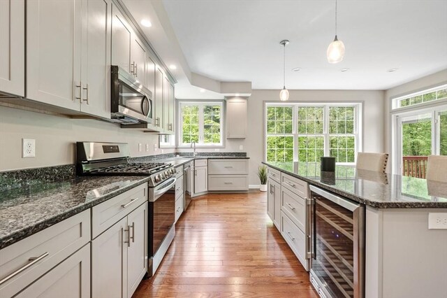 233A Green St Unit A, Boylston, MA 01505 - kitchen with stainless steel appliances, wine cooler, light wood finished floors, plenty of natural light, and recessed lighting