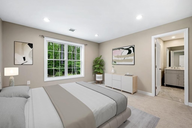 233A Green St Unit A, Boylston, MA 01505 - bedroom featuring light carpet, baseboards, recessed lighting, a sink, and ensuite bath