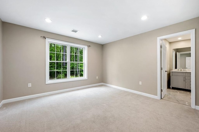 233A Green St Unit A, Boylston, MA 01505 - unfurnished room with light colored carpet, baseboards, recessed lighting, and a sink