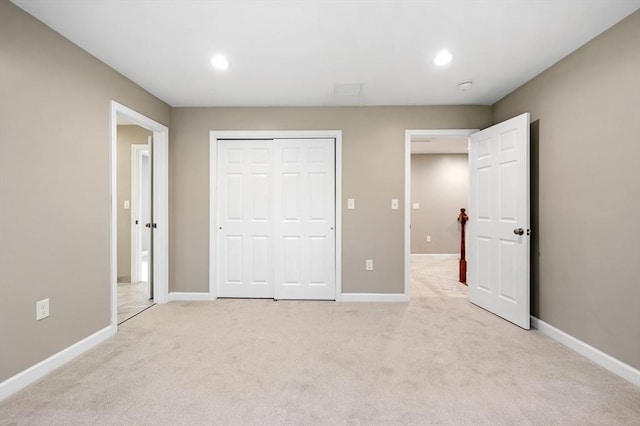 233A Green St Unit A, Boylston, MA 01505 - unfurnished bedroom featuring light carpet, baseboards, recessed lighting, and a closet